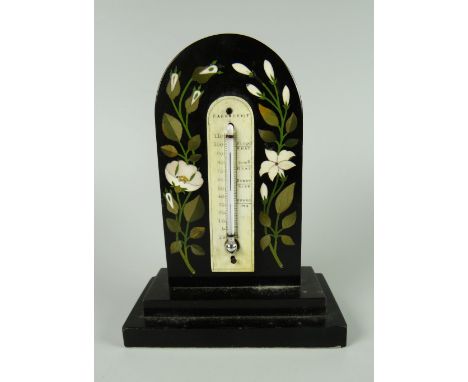 NINETEENTH CENTURY BLACK MARBLE ARCH TOPPED DESK THERMOMETER inlaid with floral sprays, raised on rectangular stepped base, p