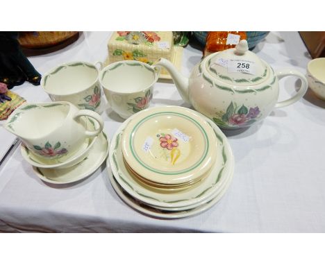 1950's Susie Cooper tete-a-tete viz teapot, two cups and saucers, tea plate, spoon rest, cream jug, sugar basin and larger si