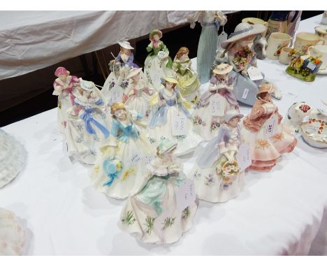 A set of 12 limited edition Royal Worcester flower figures 