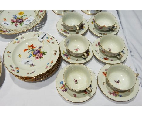 Set of six Meissen porcelain cups and saucers and matching plates, 19.5cm diameter, all with gilt serpentine borders, painted