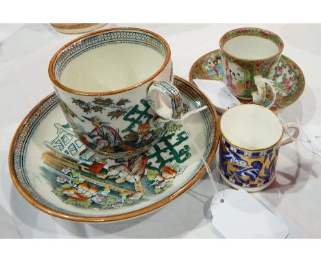 A Coalport ceramic coffee can in aesthetic style, a porcelain Canton cabinet cup and saucer decorated with floral and scroll 
