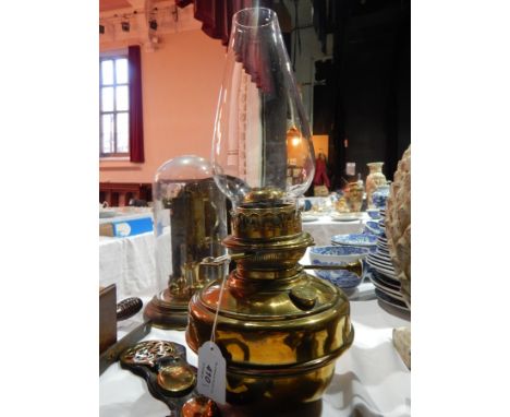 A brass oil lamp and other items 