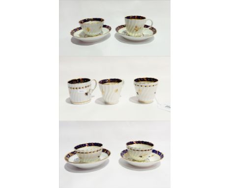 18th century Worcester porcelain trio, all decorated in royal blue and gilt with foliate branch border, stylised floral sprig