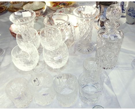 A quantity of glassware to include cut glass cylindrical decanter and stopper, pair flared rim glasses, similar jug, stemmed 