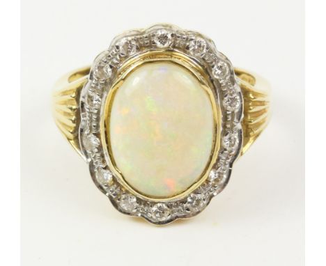 Australian opal and diamond cluster ring stamped 18ct (opal approx 2.25 carat)   Condition Report   Click here for further im