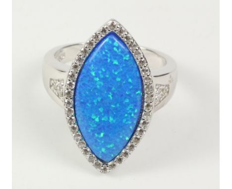 Large blue opal dress ring stamped 925   Condition Report   Click here for further images, condition, auction times & deliver