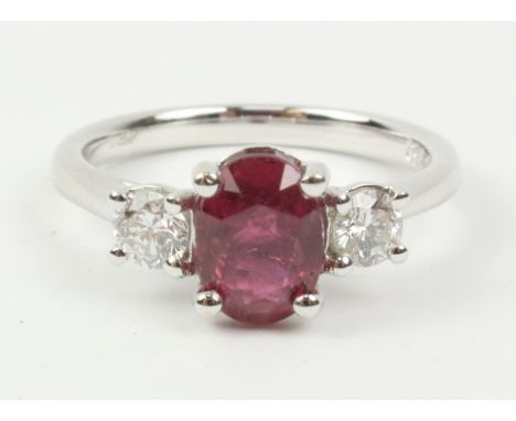 Oval ruby and brilliant cut diamond white gold ring hallmarked 18ct (ruby approx 2 carats)   Condition Report   Click here fo