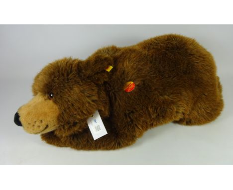 Steiff brown bear laying, L75cm    Condition Report   Click here for further images, condition, auction times & delivery cost
