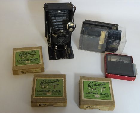 Contessa-Nettel folding plate camera and magic lantern slides in one box    Condition Report   Click here for further images,