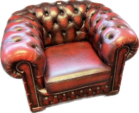 Chesterfield single tub armchair, covered in a red leather button upholstery 