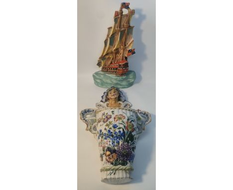 An Art Deco Ditmar Urbach of Czechoslovakia painted pottery wall plaque; modelled as a galleon along with A Portuguese large 
