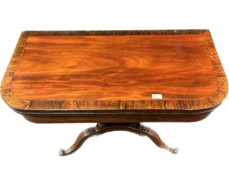 19th Century card table, the D shaped surface with flip top raised on four carved chambers and carved cabriole legs ending in