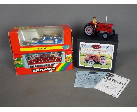 Britains - A collection of boxed farm implements by Britains. Lot contains Britains #08716 David Brown 900 Tractor; #9550 Fol