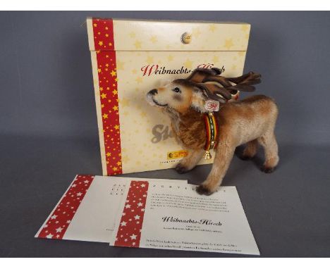 Steiff - a Limited Edition Steiff Christmas Stag, No. 1295 of 1500 with white button in ear and collar with bells, in origina