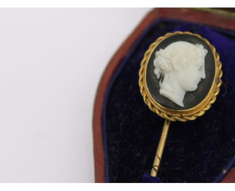 A 19th Century yellow metal cameo stick pin, length 7.5cm, with box