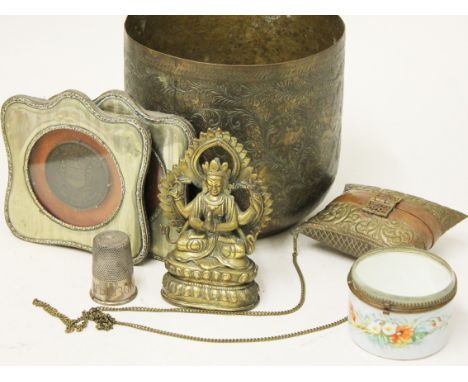 A mixed lot comprising an Indian brass jardiniere, two framed medallions, a brass cushion purse, a porcelain and glass trinke