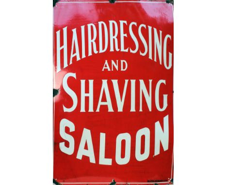 A red enamel sign HAIRDRESSING AND SHAVING SALOON Watts Bros NYC Ltd 61cm x 76cm. Condition - rusty and loss around the fixin