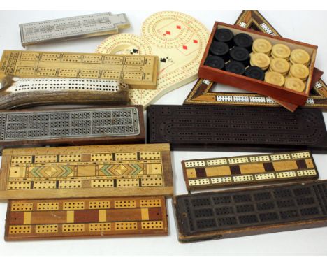 A collection of cribbage boards including one made from an antler