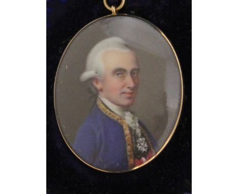 English School circa 1800, miniature portrait of a gentleman wearing a blue coat and adorned with a medal, gold metal frame, 