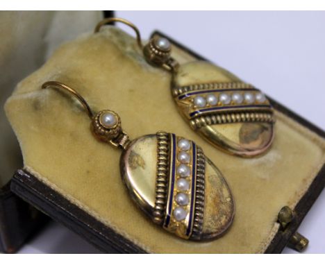 A pair of Victorian yellow metal, pearl and enamel earrings, length 4.3cm, gross weight 9.9g with box
 
Condition very good, 