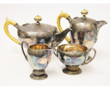 An Art Deco four piece silver tea service, the tea and coffee pots having ivory handles and finials, Frank Cobb &amp; Co. She