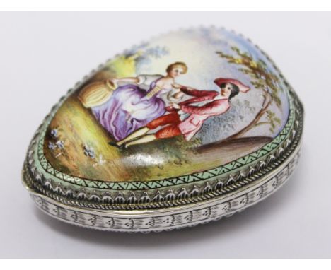 A Continental 19th Century white metal and enamel heart shaped snuff box, each side decorated with a romancing couple, the in