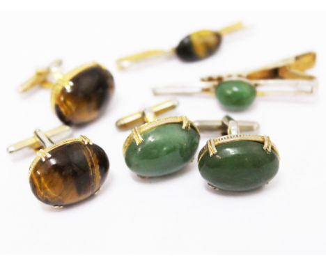 A pair of jade colour cabochon cufflinks and another
