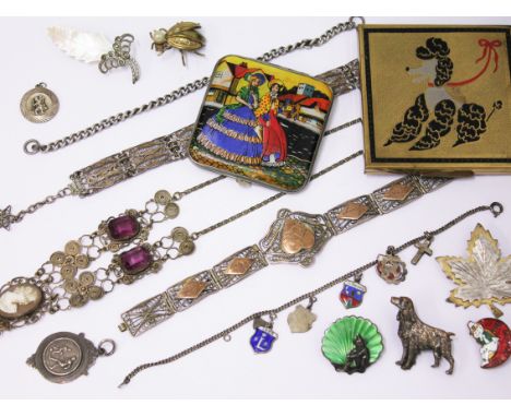 A mixed lot of costume jewellery to include a Kenart dog brooch, a silver and enamel brooch, two vintage compacts, filigree a