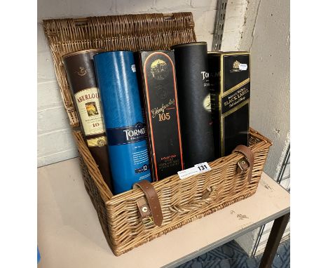 SEVEN BOTTLES OF WHISKEY IN A HAMPER BASKET