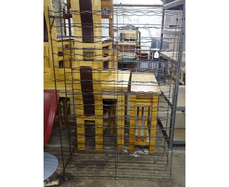 A wrought-iron wine rack, W100cm, H150cm 