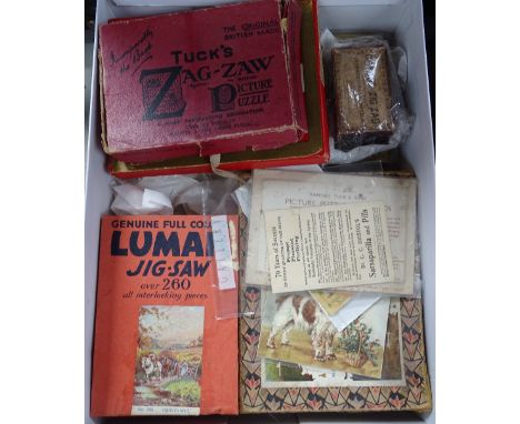 A box of Vintage jigsaw puzzles, children's games etc 