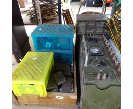A Vintage amp meter, a metal bank of drawers, tins of equipment etc 