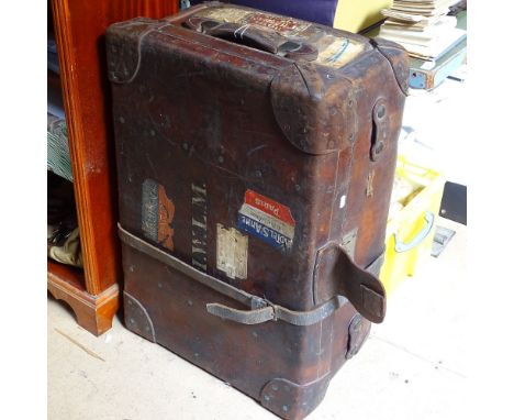 A large Vintage leather travel trunk with labels, length 30.5" 