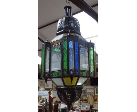 A Moroccan style ceiling lantern with coloured glass panels, height 28" approx 
