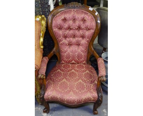 A Victorian rosewood-framed open armchair, with button-back upholstery 
