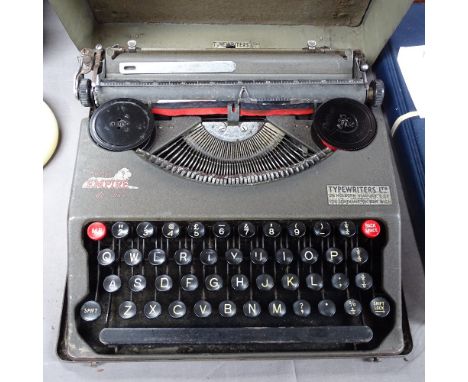 A Vintage Baby Empire Deluxe portable typewriter, with metal case 