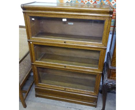 A 1920s oak Globe Wernicke 4-section bookcase, W86cm 