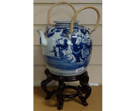 A Chinese blue and white teapot on wooden stand, height approx 13" 