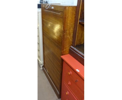 A Vintage oak office filing cabinet, with single tambour door, W81cm 