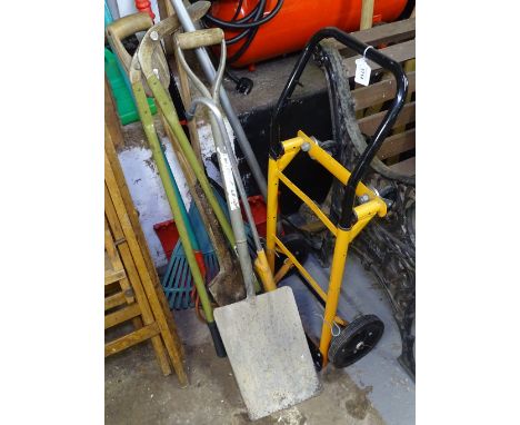 A collection of long-handled gardening tools, to include racks, a pick axe, a sledge hammer etc 