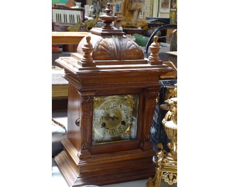 Carved oak-cased 2-train mantel clock, 18.5" 