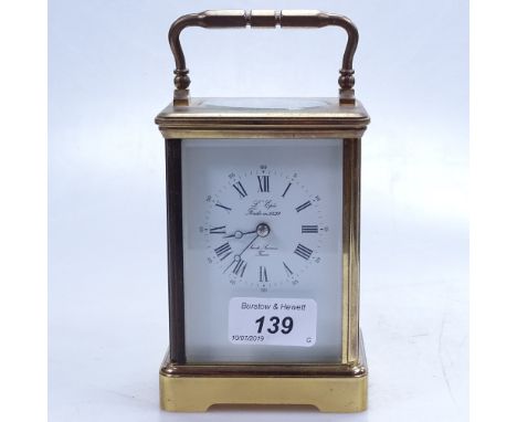 A French brass carriage clock, height 5", with key 