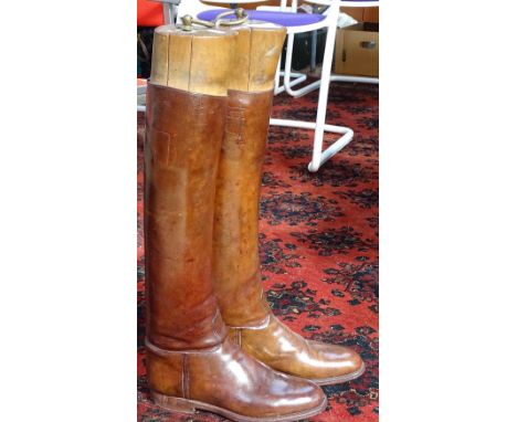 A pair of leather 1930s army riding boots with wooden trees 
