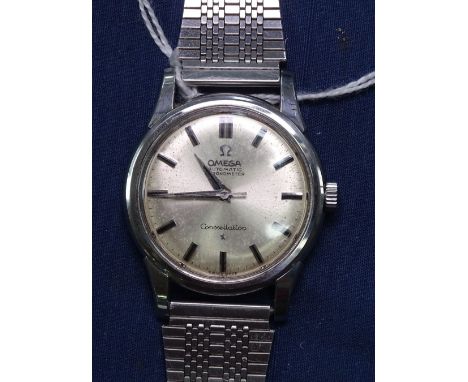A gent's stainless steel-cased Omega Constellation watch, with silver baton dial, automatic chronometer movement, working ord