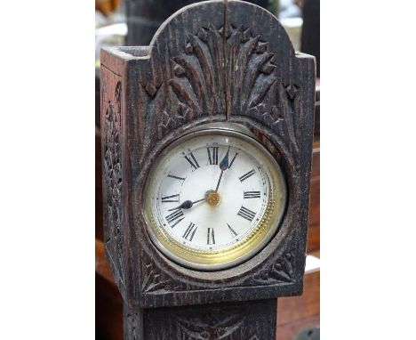 A miniature longcase clock in carved wood case, 12.75" 