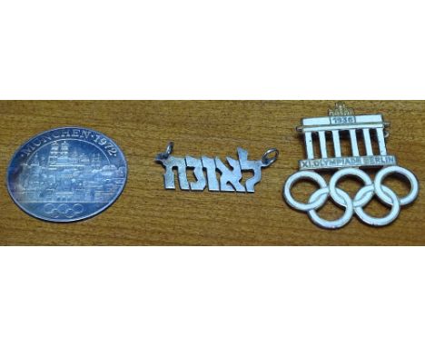 A 1936 Berlin Olympic enamel badge, a 1972 Munich Olympic coin, and a Jewish pendant 