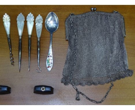 A silver mesh evening bag, mother-of-pearl handled corkscrew button hook, and a silver and enamel spoon etc 