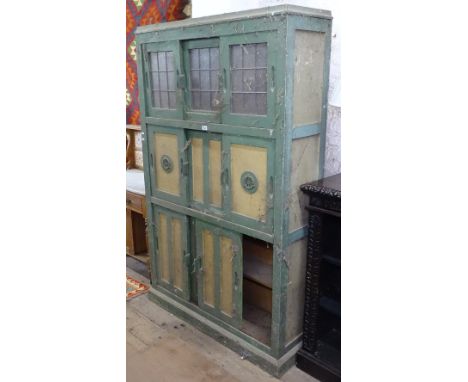 A Vintage painted kitchen cabinet, with glazed and panelled sliding doors, W113cm, H184cm 