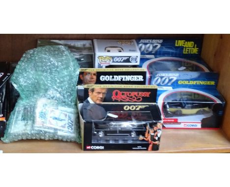 A shelf of James Bond film memorabilia 