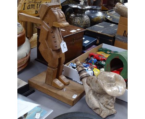 A carved wood novelty figure nutcracker, 14", and a pottery pipe, modelled as a man wearing a Stetson 